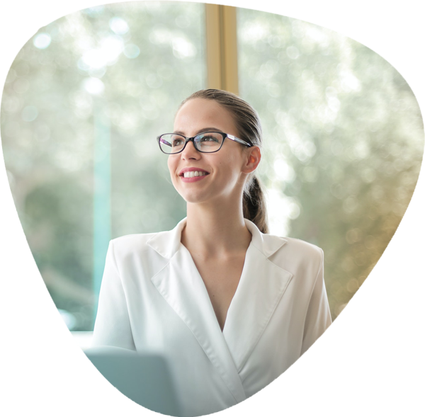 A businesswoman with glasses and a white shirt.